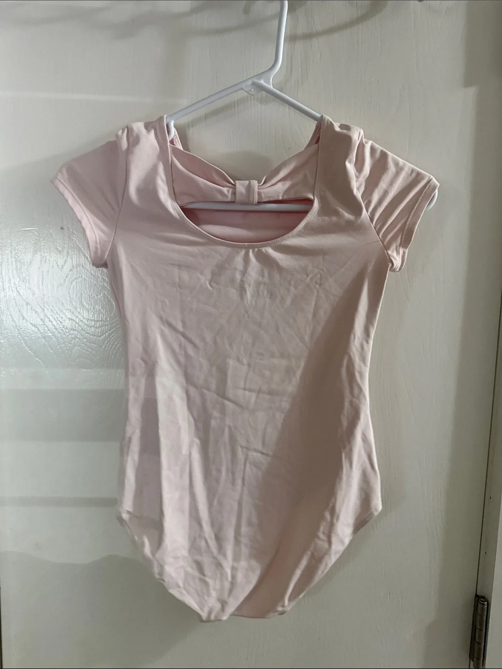Justice Light Pink Short Sleeve One-Piece Bodysuit